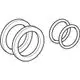Set aus O-Ringen und Trennscheiben, geeignet für Geberit Produkte. Die Teile sind kreisförmig und gestapelt angeordnet, wobei zwei größere und zwei kleinere Ringe sichtbar sind.