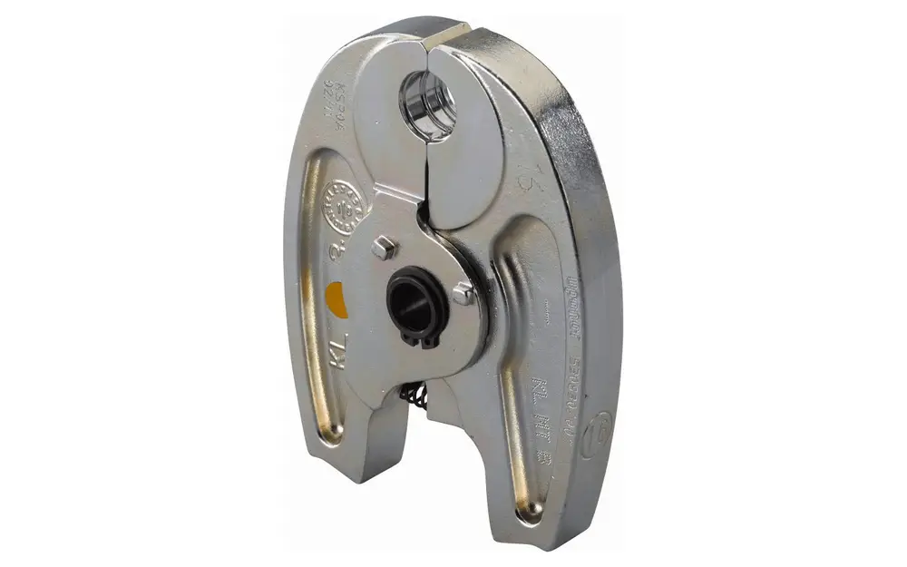 Pressbacken von Uponor, metallisch, mit zwei Öffnungen und einem Mechanismus zur Verriegelung. Eignet sich vermutlich für Anwendungen in der Rohrverbindungstechnik.