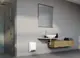 Weißer Wandheizer von Stiebel Eltron, flach an der Wand montiert, in modernem Badezimmer mit Waschbecken und Dusche im Hintergrund.
