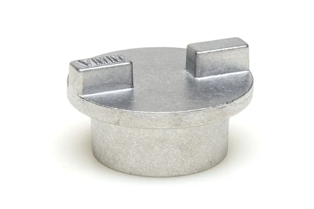 Metallische Kupplung von Resideo, rund mit zwei kleinen Erhebungen auf der Oberseite und einem zylindrischen Körper, geeignet für Stellantriebe.