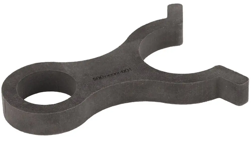 Messadapter von Resideo, schwarz, mit zwei Öffnungen in einer geschwungenen Form, dient zur Verbindung von Rohrdurchmessern.