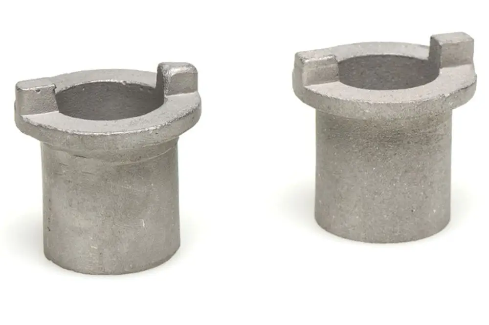 Zwei graue Metallteile mit einer Öffnung und seitlichen Einschnitten, möglicherweise Teil eines Anbausatzes, produziert von Resideo.
