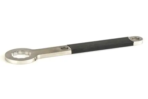 Voreinstellhebel aus Metall mit einer Gummierung an einem Ende, hergestellt von Resideo. Der Hebel hat einen runden Kopf mit mehreren Zähnen und ist für präzise Einstellungen konzipiert.
