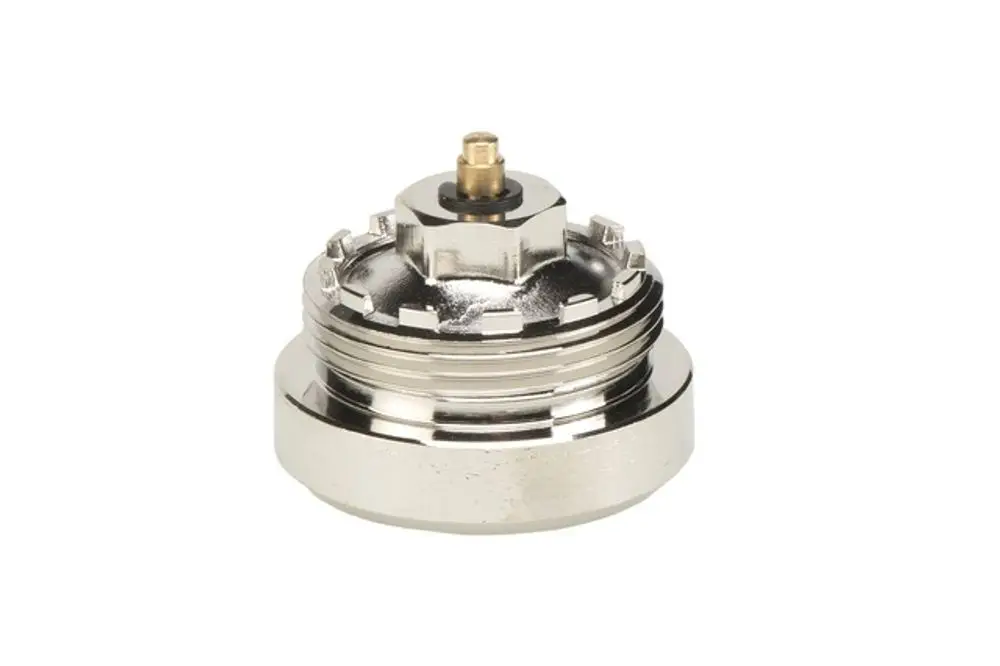 Adapter für Ventile, hergestellt von Resideo, mit metallischer Oberfläche und zentralem Anschluss. Geeignet zur Verbindung von Heizungs- oder Kühlsystemen.