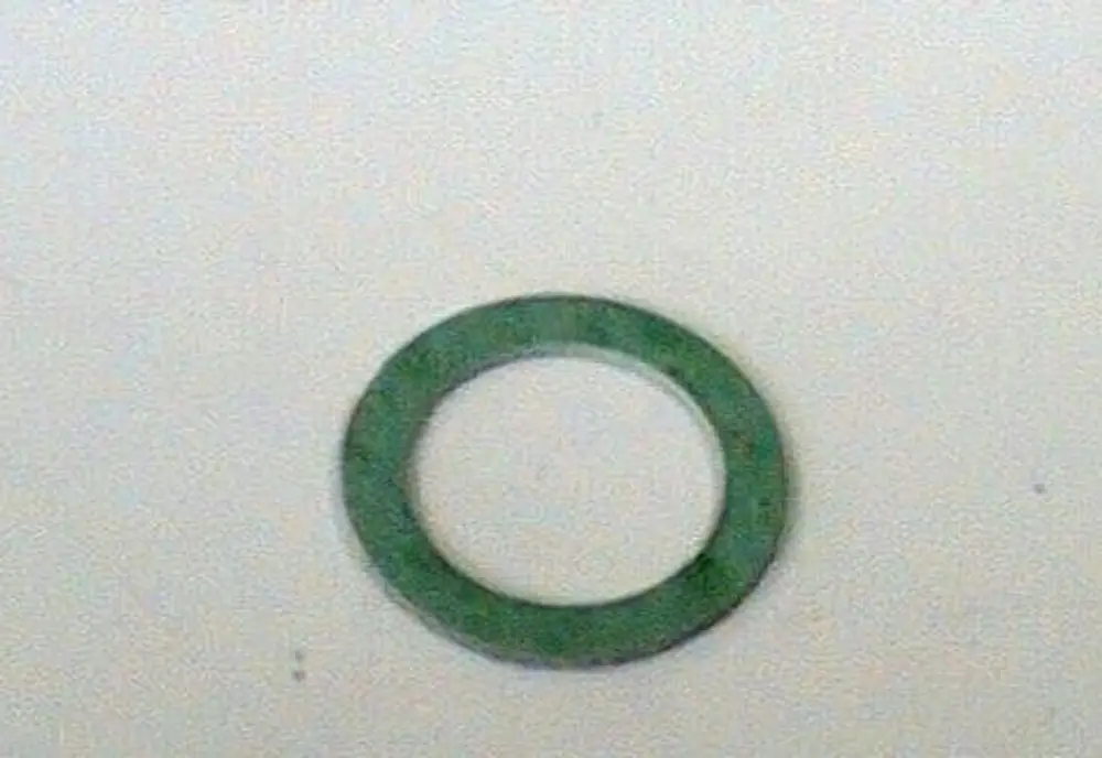Grüne Dichtung in ringförmiger Form auf hellem Hintergrund, geeignet für Anwendungen wie die Gaszuleitung, möglicherweise von der Marke Brötje.