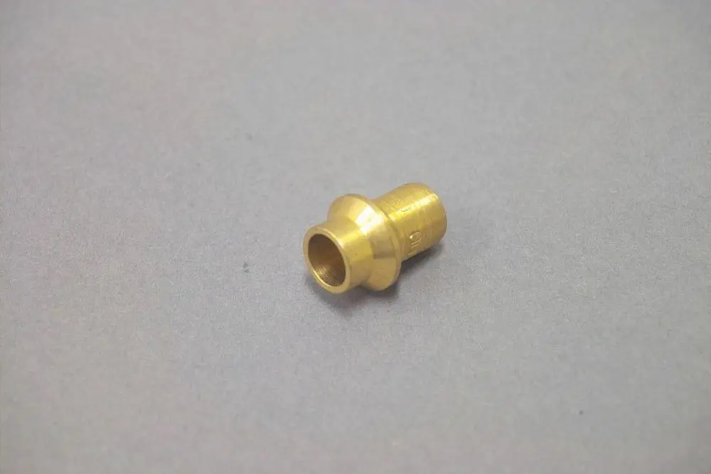 Brass piece with a funnel-shaped end, likely used as a nozzle in gas applications, associated with the Brötje heating systems.