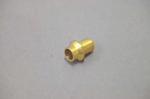 Brass piece with a funnel-shaped end, likely used as a nozzle in gas applications, associated with the Brötje heating systems.