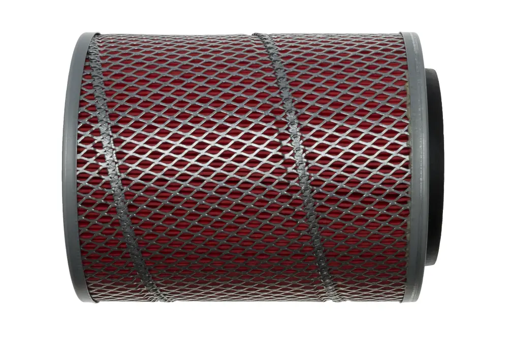 Zuluftfilter von Brötje mit einem geschlossenen Metallgitter aus rot gewebtem Material, ohne Zubehör. Der Filter hat eine zylindrische Form und eine klare Struktur.