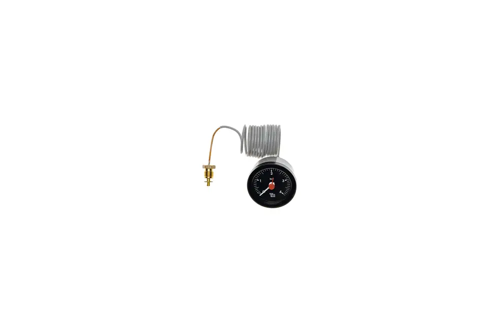 Manometer von Brötje mit schwarzem Ziffernblatt und rotem Zeiger. Eine Kupferleitung führt von der Messstelle zu einem Anschluss. Gerät zur Druckmessung in Heizungsanlagen.