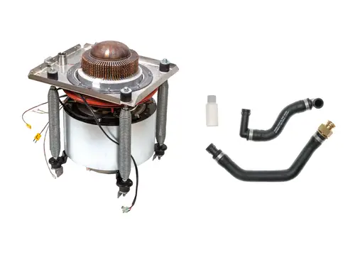 Brötje Stirlingmotor mit einer runden obersten Kupferplatte und daran befestigten Schläuchen sowie einer kleinen Flasche. Komponenten für spezifische Anwendungen im Heizungsbereich.