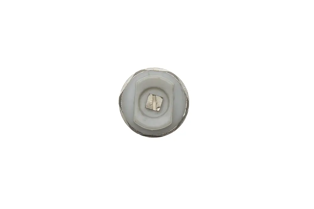Brötje Entlüfter mit runder, flacher Bauform und zentralem Schlitz. Die Oberfläche ist metallisch mit einer weißen, plastischen Innengestaltung.
