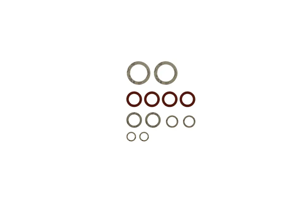 Dichtungs-Set von Brötje mit verschiedenen runden Dichtungen in unterschiedlichen Größen, sowohl aus Metall als auch aus Gummi, auf hellem Hintergrund angeordnet.