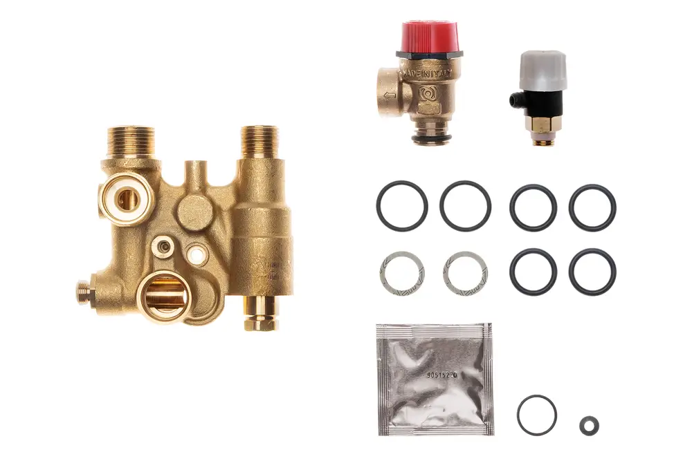 Brötje Hydraulikblock mit mehreren Anschlüssen, O-Ringen und Zusatzteilen. Komponente für Heizungsanlagen oder ähnliche Systeme.