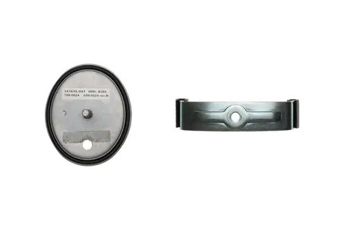 Brötje Produkt mit ovaler Metallbasis und runder Auflage. Auf der Oberfläche sind mehrere Nummern und ein ovales Loch für die Befestigung erkennbar.
