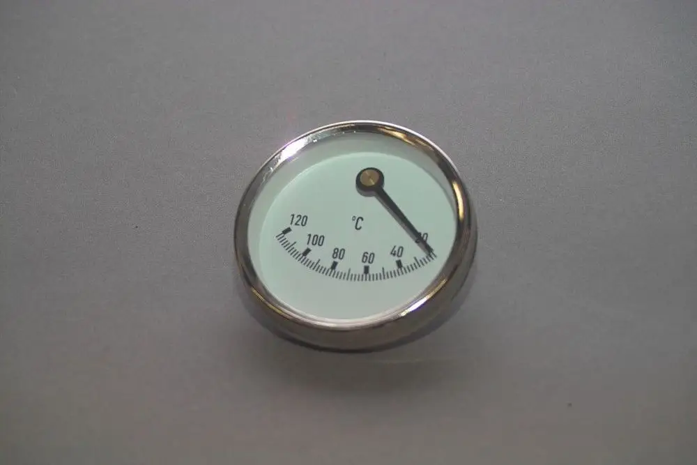 Brötje Thermometer mit analoger Anzeige, Skala von 0 bis 120 °C, runde Form mit silbernem Rahmen und weißem Zifferblatt. Zeigerbewegung auf Temperaturskala.