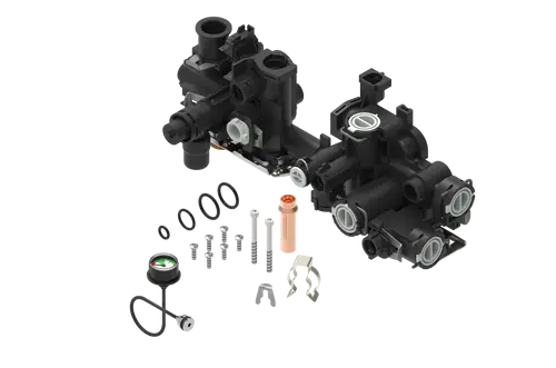 Brötje Hydraulikblock-Set, bestehend aus zwei identischen Hydraulikeinheiten, verschiedenen Dichtungen, Schrauben und Zubehörteilen für die Montage.