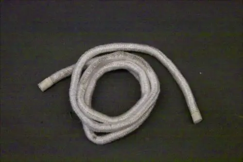 Kringel aus einem flexiblen, grauen Material mit abgeschotteten Enden, mögliches Dichtungs- oder Verbindungsstück, verwendet in Brötje Heizsystemen.
