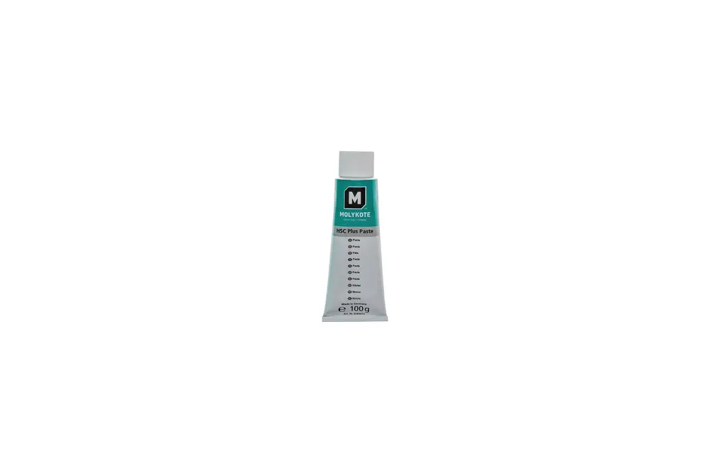 Tube mit Brötje Kupferleitpaste, beschriftet mit Produktinformationen. Die Tube hat eine weiße Oberfläche und einen grünen oberen Teil mit einem weißen Verschluss.