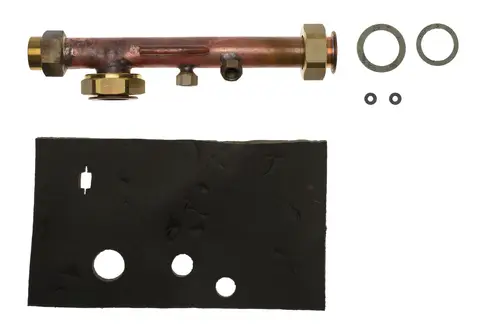 Brötje Rücklaufverteiler, aus Metall, mit verschiedenen Anschlüssen und Dichtungen. Enthält ein schwarzes Dichtmaterial mit mehreren Aussparungen.
