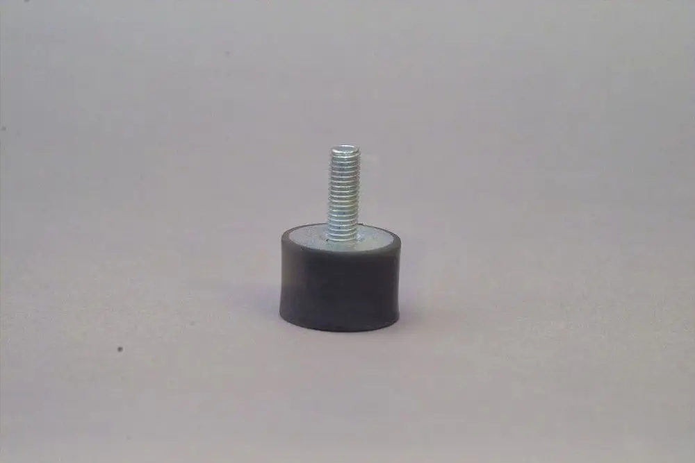 Brötje Schwingungsdämpfer in zylindrischer Form mit einer Metallbefestigungsschraube, montierbar auf unterschiedlichen Oberflächen.