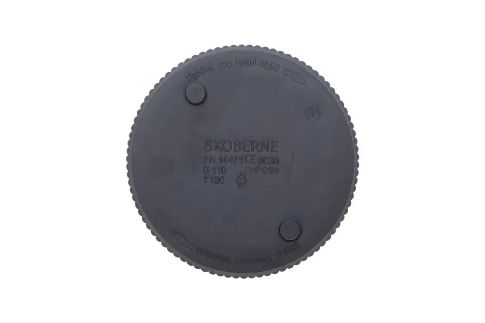 Schwarzer Revisionsdeckel mit texturiertem Rand und Herstellerangabe „Brötje“. Auf der Oberseite befinden sich zwei vertiefte Punkte zur Handhabung.