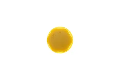 Gelbe Kappe von Brötje, sechseckige Form, auf weißem Hintergrund. Keine weiteren Informationen zur Produktbezeichnung oder Maßen sichtbar.