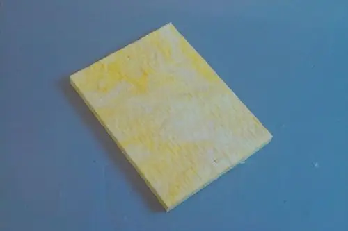 Gelbe Dichtung mit gerippter Oberfläche, platziert auf einer grauen Unterlage. Produkt könnte zur Verwendung in Brötje Heizsystemen geeignet sein.