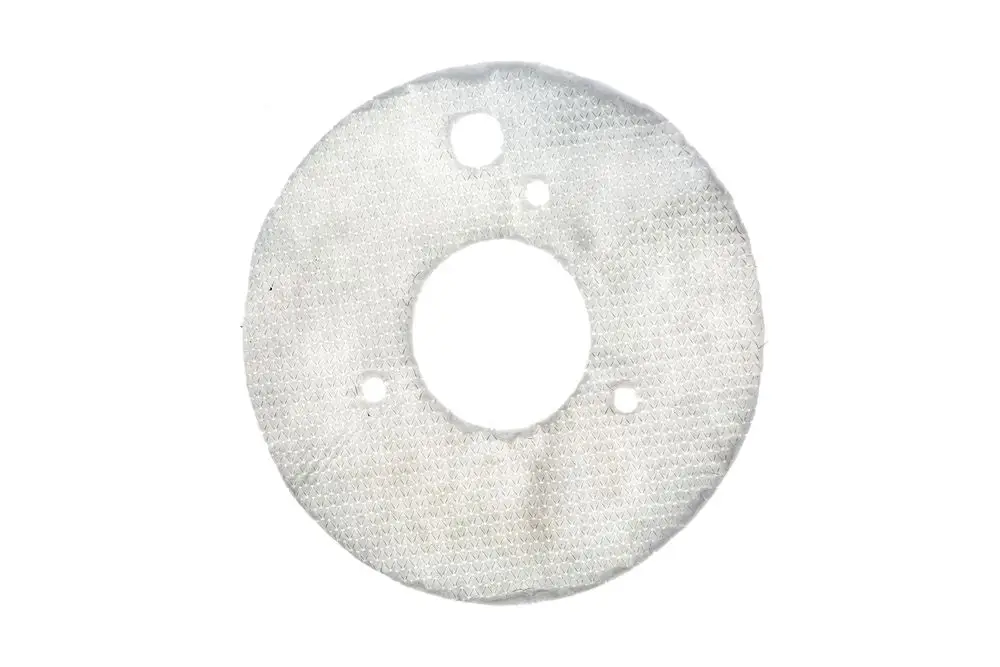 Dichtungsmatte in runder Form mit zentralem Loch und mehreren zusätzlichen Bohrungen, verwendet für Brötje Heizsysteme zwischen Tür und Isolierstein.