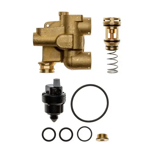 Brötje Hydroblock, bestehend aus einem Hauptkörper aus Messing, einem Ventil, einer Feder, Dichtungen und weiteren Komponenten, angeordnet auf hellem Hintergrund.