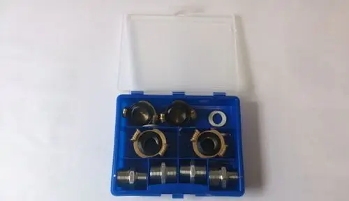 Brötje Anschluss- und Dichtungs-Set in einem blauen Behälter, enthält verschiedene Metall- und Gummidichtungen zur Verwendung in Heizungs- und Sanitärinstallationen.