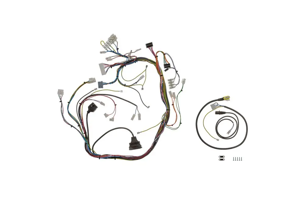 Kabelbaum von Brötje mit mehreren Anschlussklemmen und Drähten, die für elektrische Verbindungen genutzt werden. Diverse Stecker und Verbindungen sind sichtbar.