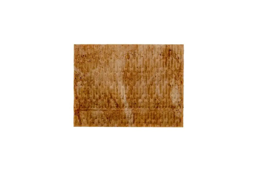 Brötje Dichtung in braunem Material mit einer strukturierten Oberfläche, rechteckig und leicht verunreinigt, auf neutralem Hintergrund.