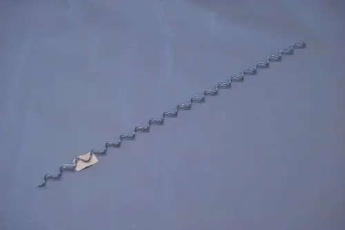 Brötje Wirbulator in spiralförmigem Design, aus Metall, mit einer Länge und Steigung, typisch für Anwendungen in wasserführenden Heizsystemen.
