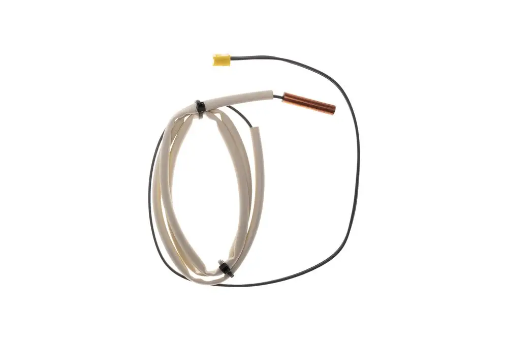Brötje Sensor mit einem langen Kabel, einem Kupferdraht und einem gelben Stecker, verlegt in einer spiralförmigen Anordnung.