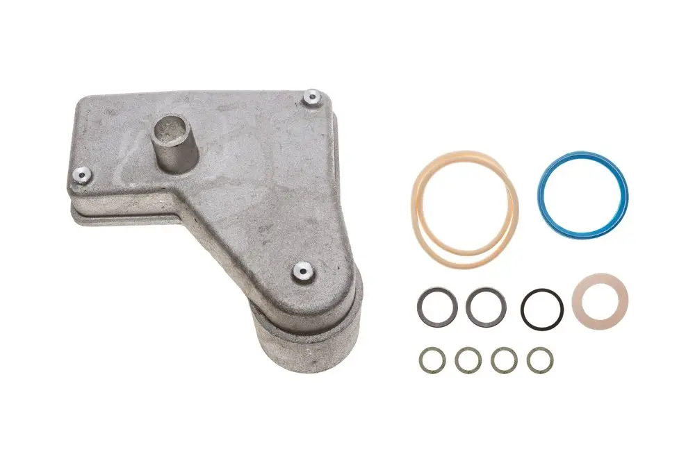 Brötje Kondenswassersammelschale aus Metall, rechteckige Form mit mehreren Bohrungen und Dichtungsringen in verschiedenen Größen und Farben, zur Verwendung in Heizsystemen.