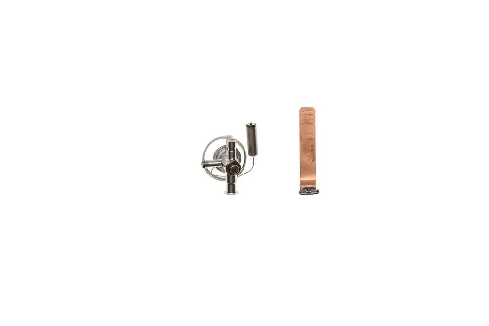 Brötje-Expansionsventil mit metallischer Struktur, bestehend aus einem runden Gehäuse und einem flachen Element. Eignet sich für Heizungsanwendungen.