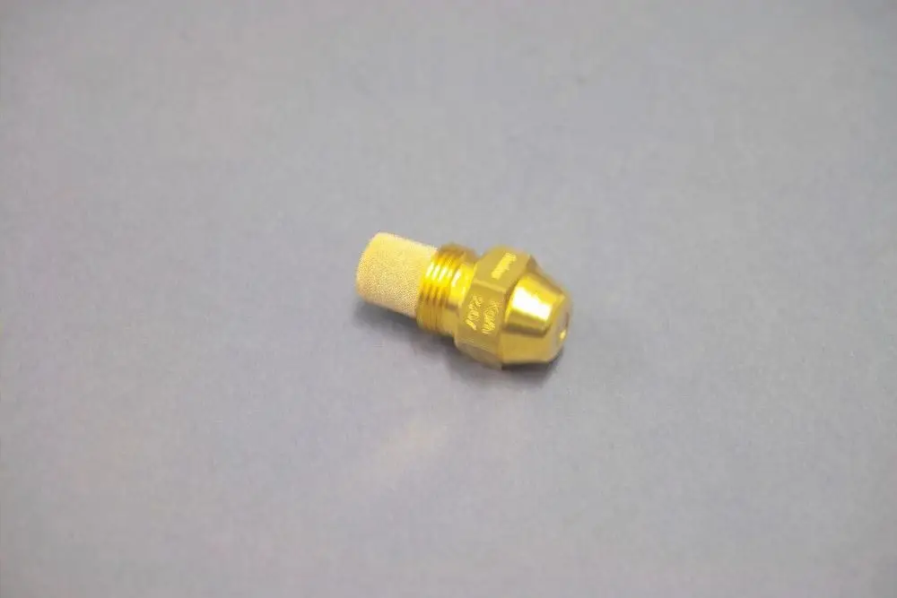 Brötje Düse in goldener Farbe mit einem zylindrischen Körper und feinmaschigem Filter am Ende, auf grauem Hintergrund.