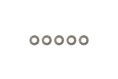 Brötje Dichtungen in Form von kleinen, runden Ringen aus Metall, angeordnet in einer Reihe vor weißem Hintergrund.