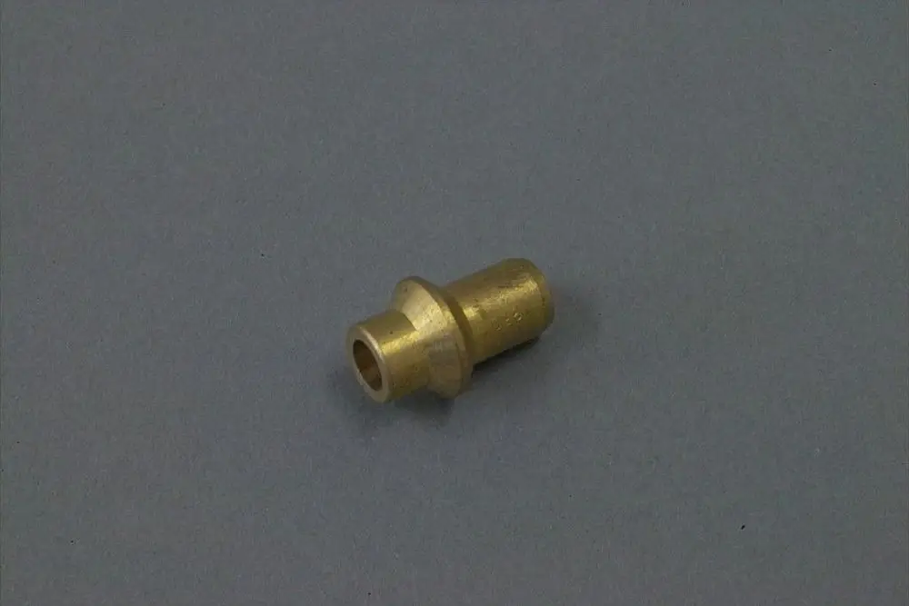 Brass piece with a cylindrical shape, possibly a nozzle, placed on a gray background. Features a wider base and a narrower top section, typical for Brötje components.