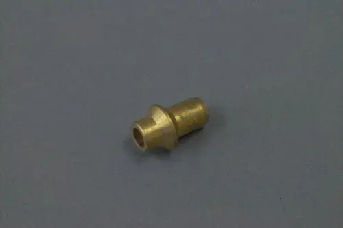 Brass piece with a cylindrical shape, possibly a nozzle, placed on a gray background. Features a wider base and a narrower top section, typical for Brötje components.