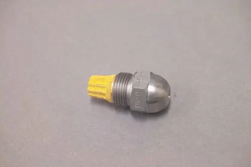 Brötje Düse aus Metall mit einer gelben Borstenstruktur an einem Ende. Das Metallteil hat eine abgerundete, glänzende Spitze und ein Gewinde auf der anderen Seite.
