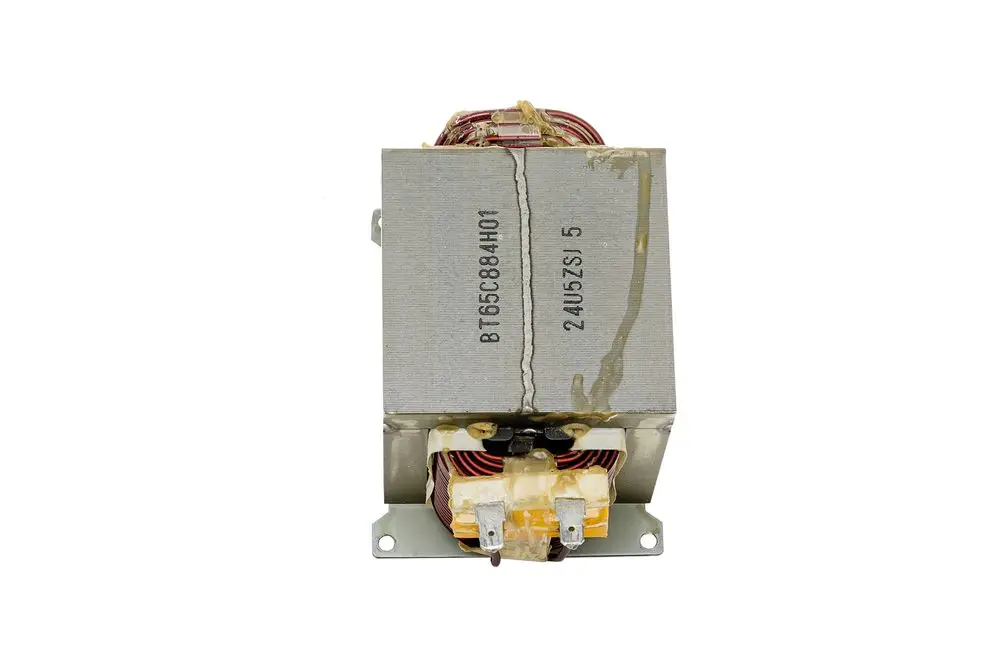 Brötje Drosselgerät mit rechteckiger Metallhülle und elektrischen Anschlüssen, sichtbar sind Wicklungen in orange und rot.