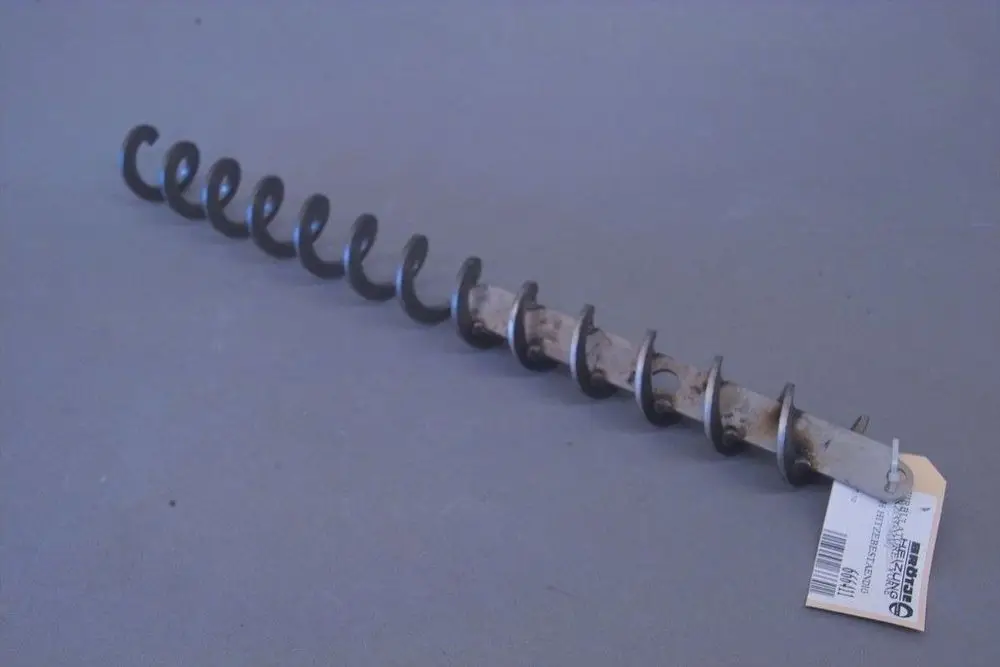 Brötje Wirbulator mit spiralförmigem Körper und mehreren Windungen, Metall, montierbar, auf grauem Hintergrund liegend.