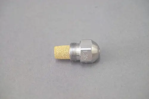 Brötje Düse aus Metall mit porösem Aufsatz, konische Form an einem Ende, Gewinde auf der anderen Seite, stehende Position auf grauem Untergrund.