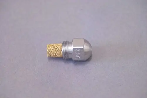 Brötje Düse mit einem metallischen Gehäuse und einem porösen Einsatz, geeignet für den Einsatz in Heizsystemen oder Ähnlichem.