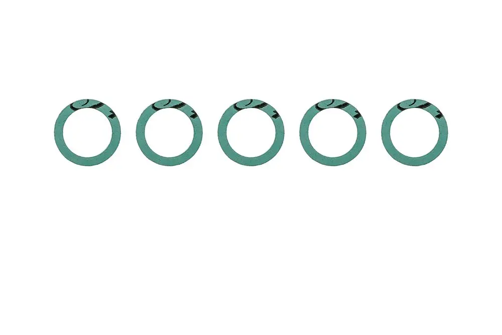 Grüne Dichtungen von Brötje in Form von Ringen, angeordnet in einer Reihe, gut sichtbar auf hellem Hintergrund.