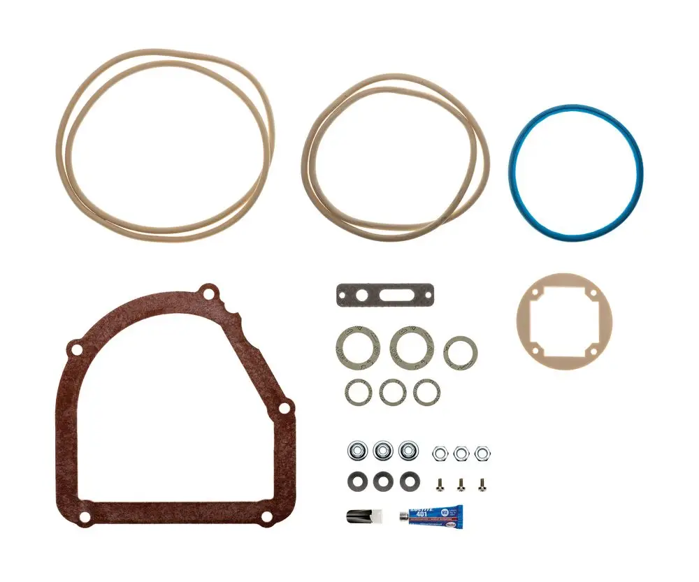 Dichtungsset von Brötje, bestehend aus verschiedenen Dichtungen, Ringen, Unterlegscheiben, Schrauben und einem Röhrchen mit Kleber, angeordnet auf weißem Hintergrund.