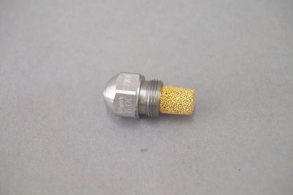 Brötje Düse aus Metall mit goldfarbener Filterstruktur. Die Düse hat eine zylindrische Form mit Gewinde und einer abgerundeten Oberseite.