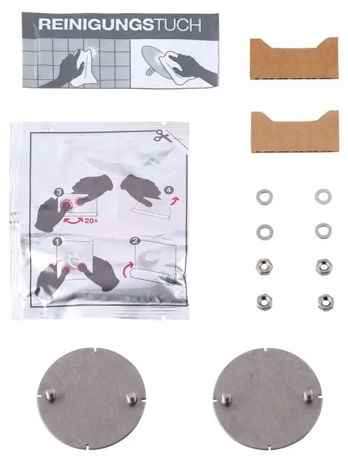 Klebe-Set von Keuco besteht aus zwei Metallplatten, zwei Kartonhaltern, Unterlegscheiben und Schrauben. Anweisungen zur Anwendung in sachem Beutel enthalten.