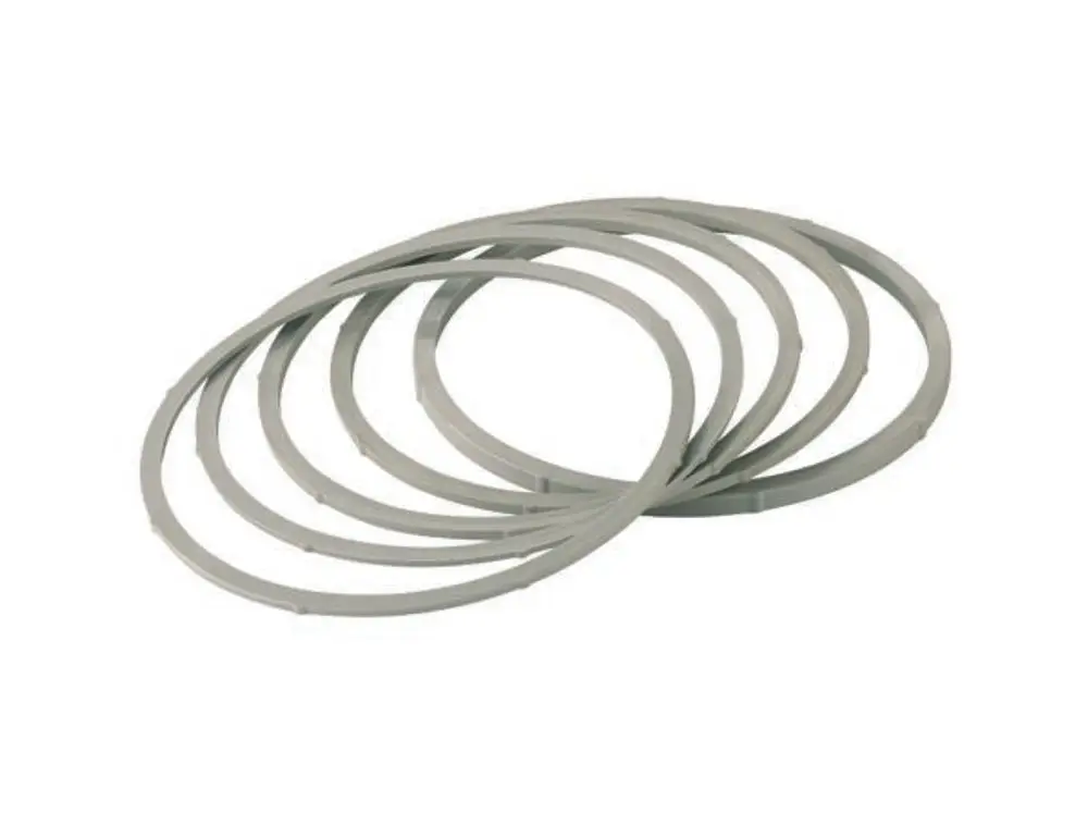 Dallmer Tragrahmen-Set, bestehend aus mehreren grauen Ringen, die übereinander liegen. Die Ringe sind gleichmäßig geformt und bieten eine einfache Verbindungslösung.